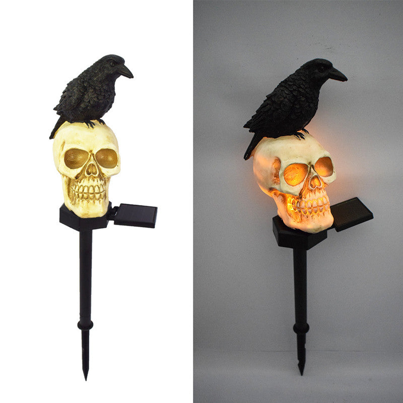 Illuminate your outdoor space with the daring Raven on Skull Solar Yard Lighting. This striking light features a raven perched atop a skull, casting an eerie glow powered by solar energy.