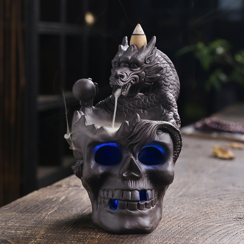 Elevate your space with the Aromatherapy Skull Dragon Backflow Incense Burner. This striking piece combines dramatic skull and dragon motifs to create a captivating focal point.