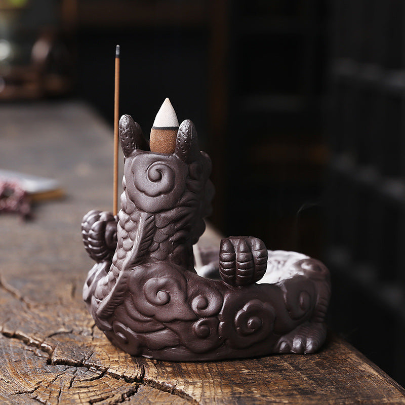 This beautiful Small Dragon Back Flow Incense Burner is a perfect addition to any home. Crafted with intricate details and made from durable material, this incense burner will create an enchanting atmosphere in any room.