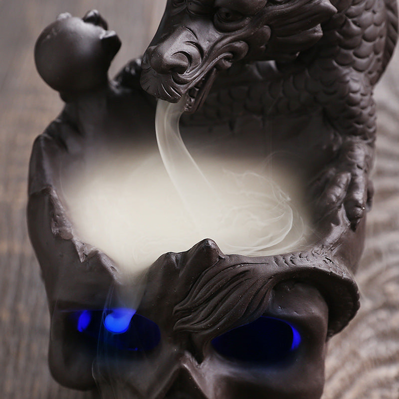 Elevate your space with the Aromatherapy Skull Dragon Backflow Incense Burner. This striking piece combines dramatic skull and dragon motifs to create a captivating focal point.