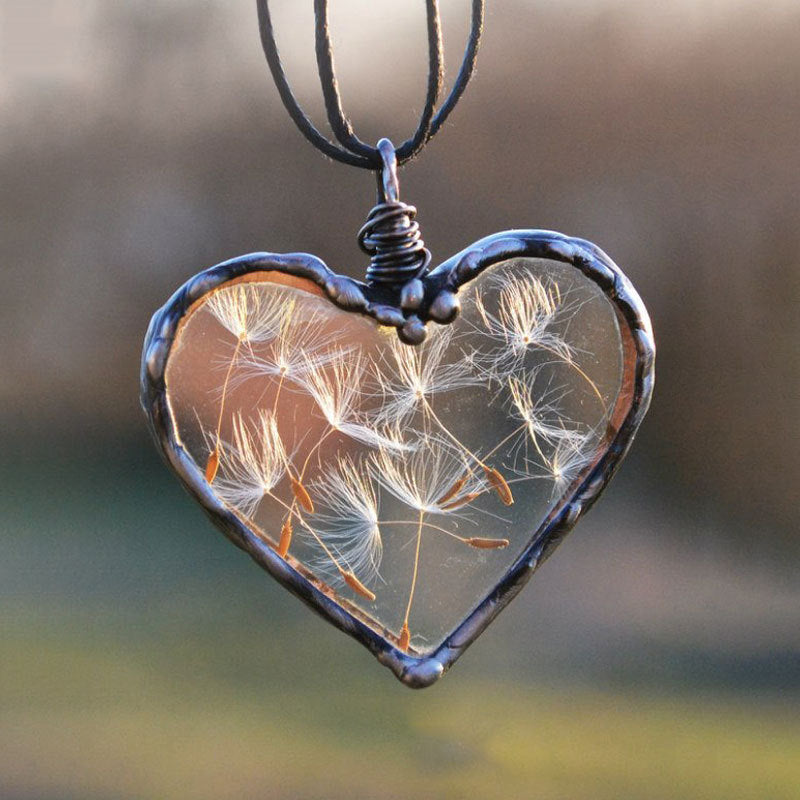 Make a wish with this beautiful handmade Dandelion Make-A-Wish Necklace. The delicate dandelion pendant is a reminder to always believe in your dreams and never stop wishing. Crafted with care, this necklace is a unique piece that will add a touch of magic to any outfit.