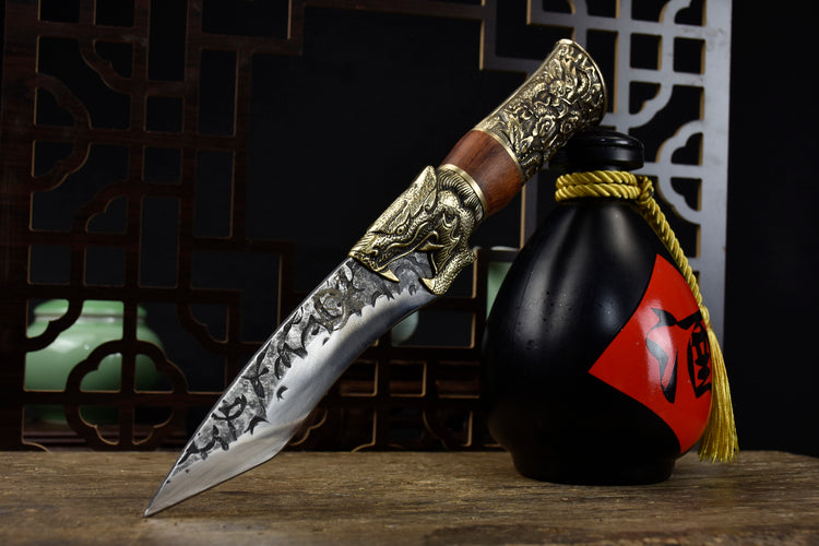 Yulong Single Bone Knife Product Information:  Full length: 28.5cm. Blade length: 14cm. Handle length: 10.5cm. Blade width: 4.0cm at the widest point. Thickness: 0.3cm. Blade material: 7Cr17Mov (7 chromium 17 molybdenum vanadium steel). Handle material: rosewood, fittings: brass.  This knife is being shipped from China, please allow 6 to 8 weeks for delivery. Thank you for your patience.