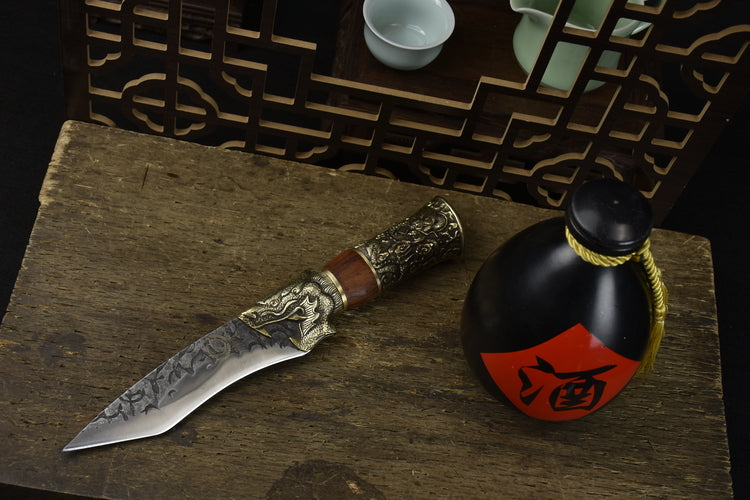 Yulong Single Bone Knife Product Information:  Full length: 28.5cm. Blade length: 14cm. Handle length: 10.5cm. Blade width: 4.0cm at the widest point. Thickness: 0.3cm. Blade material: 7Cr17Mov (7 chromium 17 molybdenum vanadium steel). Handle material: rosewood, fittings: brass.  This knife is being shipped from China, please allow 6 to 8 weeks for delivery. Thank you for your patience.