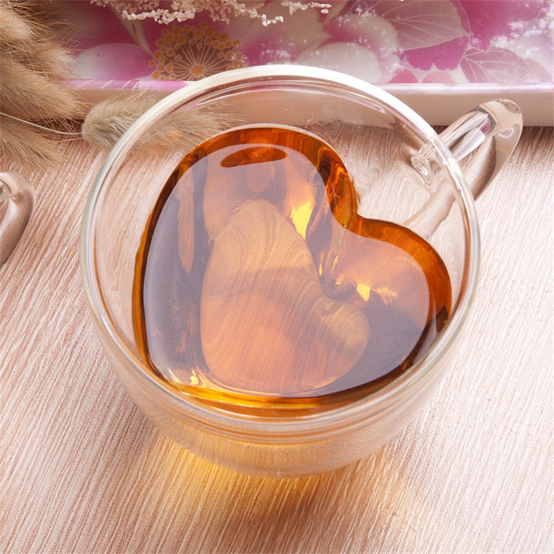 This soft heart shaped double wall glass mug is perfect for that lovers picnic in the park. Enjoy hot or cold drinks while whispering I love you to your sweetheart. Makes a lovely Valentine's gift, anniversary gift, birthday gift or gift for any special occasion.