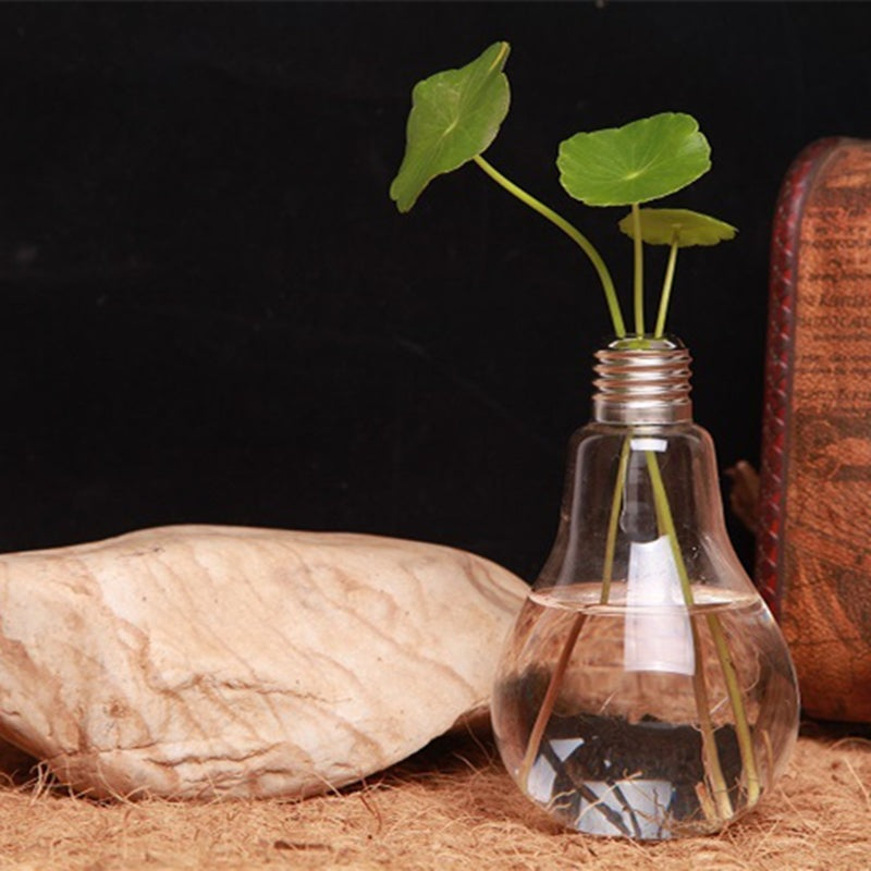 Product Name: Creative Bulb Vase Product material: high boron glass Product size: bottle mouth of about 2.5cm, bottle belly of about 8cm, bottle height of about 14cm Product features: simple fashion, suitable for any corner of the home, will be perfect for good scenery. Instructions: pour the clear water directly into the bottle and insert the plant you like.