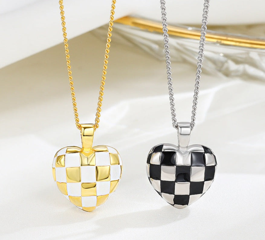 This beautiful S925 Sterling Silver Necklace features a delicate checkerboard heart pendant that adds a subtle luxe touch to any look. Crafted of the highest-quality sterling silver, this piece will maintain its brilliant shine for years to come. Delicately crafted with intricate details, this piece is sure to be cherished for a lifetime.