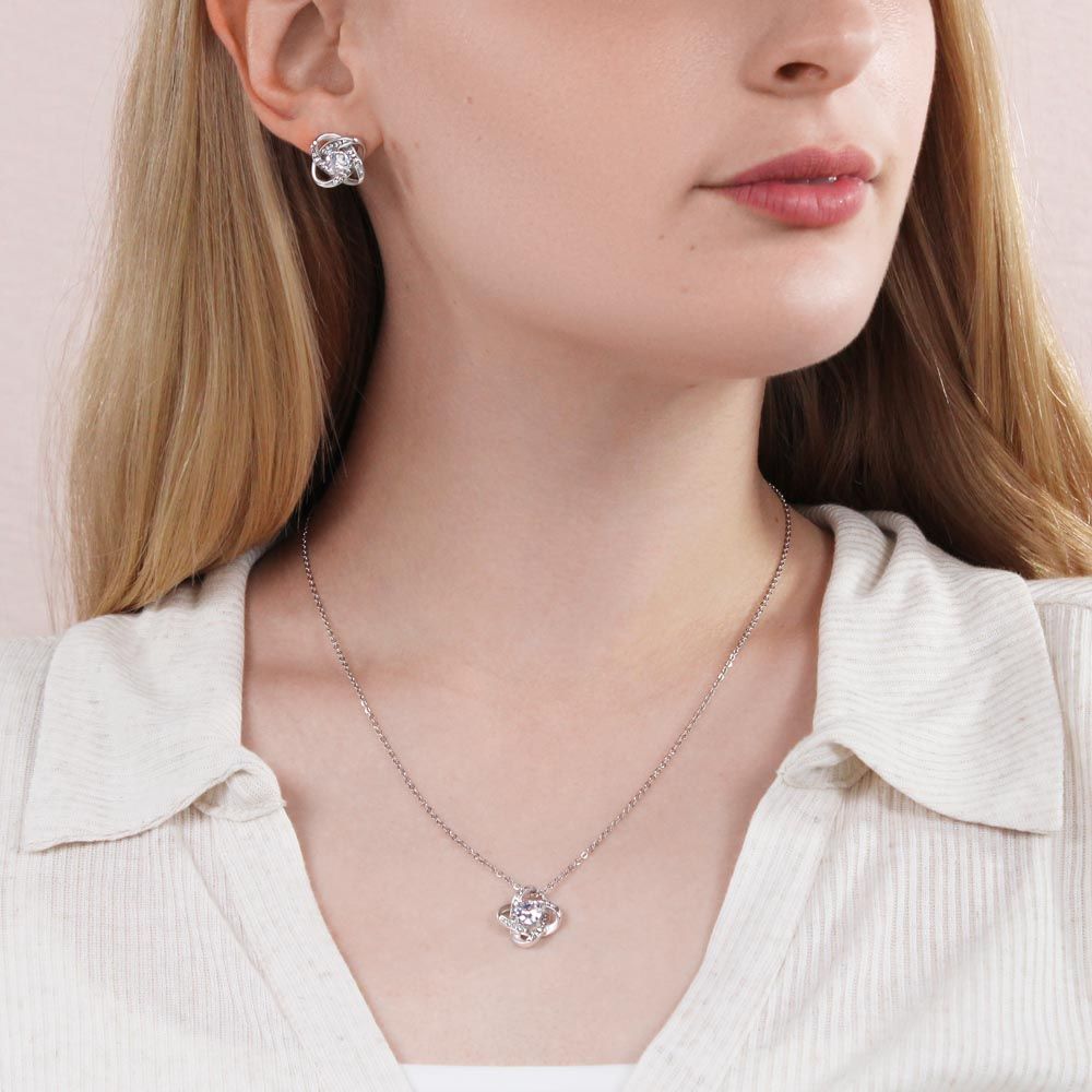 The Love Knot design represents an unbreakable bond between two souls. This symbol of never ending love is a forever favorite and trending everywhere. Each beautiful Love Knot is crafted with brilliant 14k white gold over stainless steel, surrounding a dazzling 6mm cubic zirconia crystal, and further accented with even more CZ's, showcasing added sparkle and shine to this gorgeous gift. You must see it for yourself!