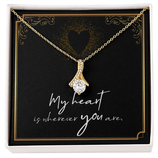 Imagine her reaction when she opens this stunning gift! The Alluring Beauty necklace features a petite ribbon shaped pendant that is sure to dazzle your special someone. Whether it's a birthday or anniversary, make sure to get her a gift she will love for years to come.