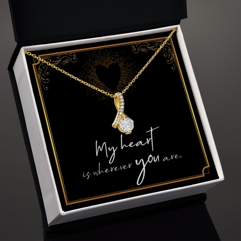 Imagine her reaction when she opens this stunning gift! The Alluring Beauty necklace features a petite ribbon shaped pendant that is sure to dazzle your special someone. Whether it's a birthday or anniversary, make sure to get her a gift she will love for years to come.