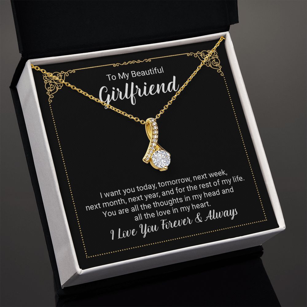 Imagine her reaction when she opens this stunning gift! The Alluring Beauty necklace features a petite ribbon shaped pendant that is sure to dazzle your special someone. Whether it's a birthday or anniversary, make sure to get her a gift she will love for years to come.