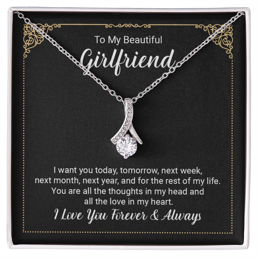 Imagine her reaction when she opens this stunning gift! The Alluring Beauty necklace features a petite ribbon shaped pendant that is sure to dazzle your special someone. Whether it's a birthday or anniversary, make sure to get her a gift she will love for years to come.