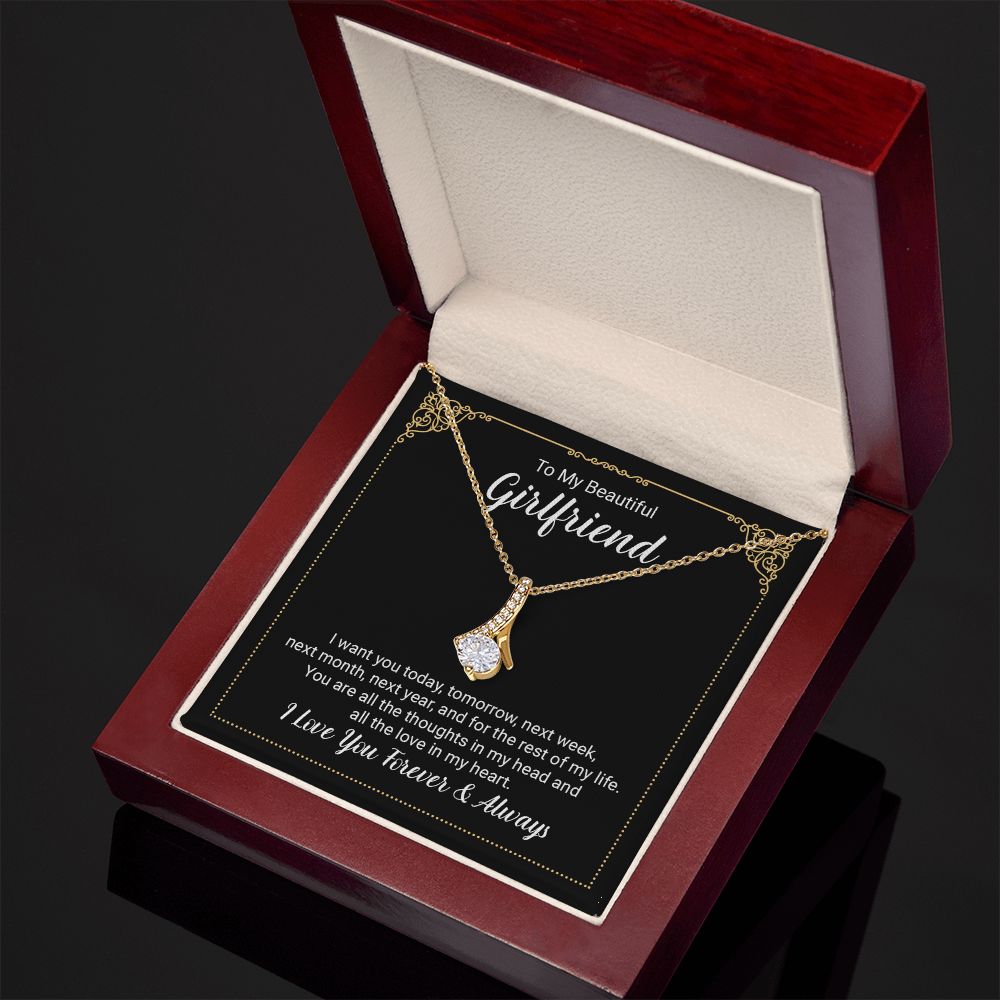 Imagine her reaction when she opens this stunning gift! The Alluring Beauty necklace features a petite ribbon shaped pendant that is sure to dazzle your special someone. Whether it's a birthday or anniversary, make sure to get her a gift she will love for years to come.