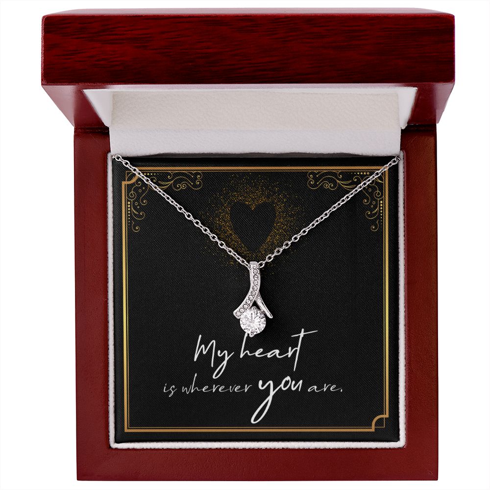 Imagine her reaction when she opens this stunning gift! The Alluring Beauty necklace features a petite ribbon shaped pendant that is sure to dazzle your special someone. Whether it's a birthday or anniversary, make sure to get her a gift she will love for years to come.
