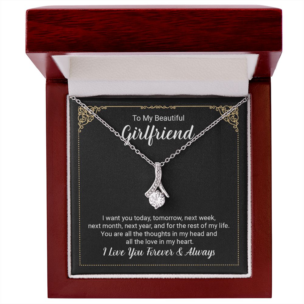 Imagine her reaction when she opens this stunning gift! The Alluring Beauty necklace features a petite ribbon shaped pendant that is sure to dazzle your special someone. Whether it's a birthday or anniversary, make sure to get her a gift she will love for years to come.