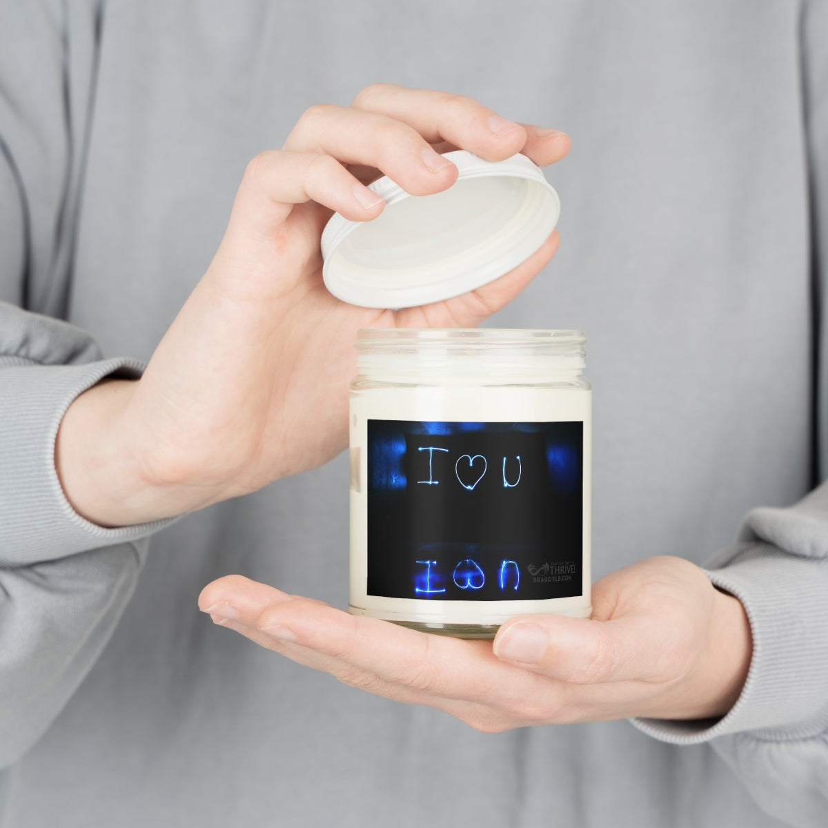 This custom candle jar can accommodate all your ideas, artwork, or inspirational quotes on its custom candle label. The candle itself is made 100% with a natural soy wax blend and cotton wick. Choose between ambrosial fragrances such as Vanilla Bean, Comfort Spice, and Sea Breeze.