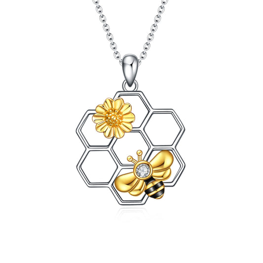 A rolo type chain that is 18 inches with an extra 2 inch extension. Gold and silver pendant with Zircon stone and comes in a delicate jewelry box.