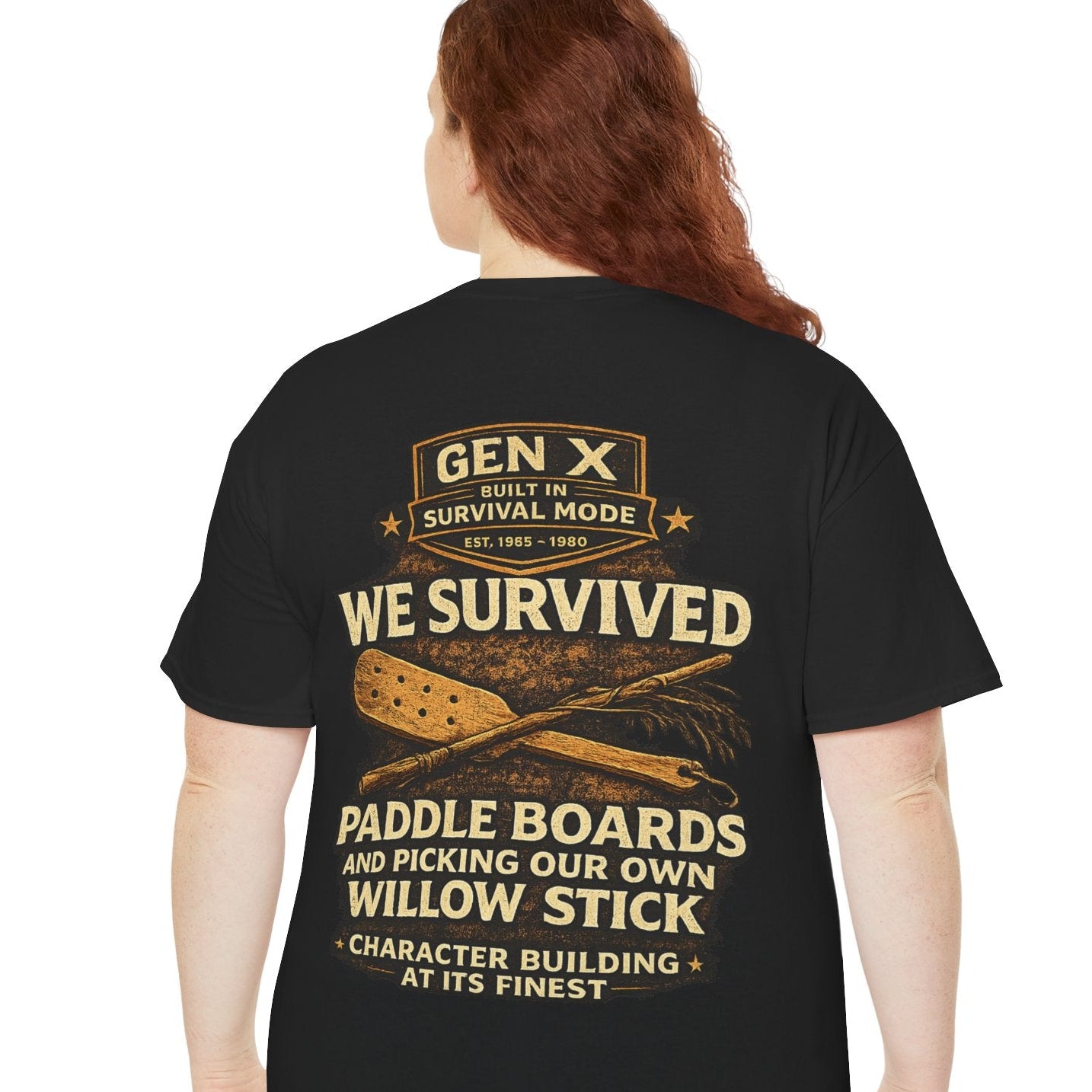 Person wearing a black t-shirt with text and graphics on the back, standing against a white background.