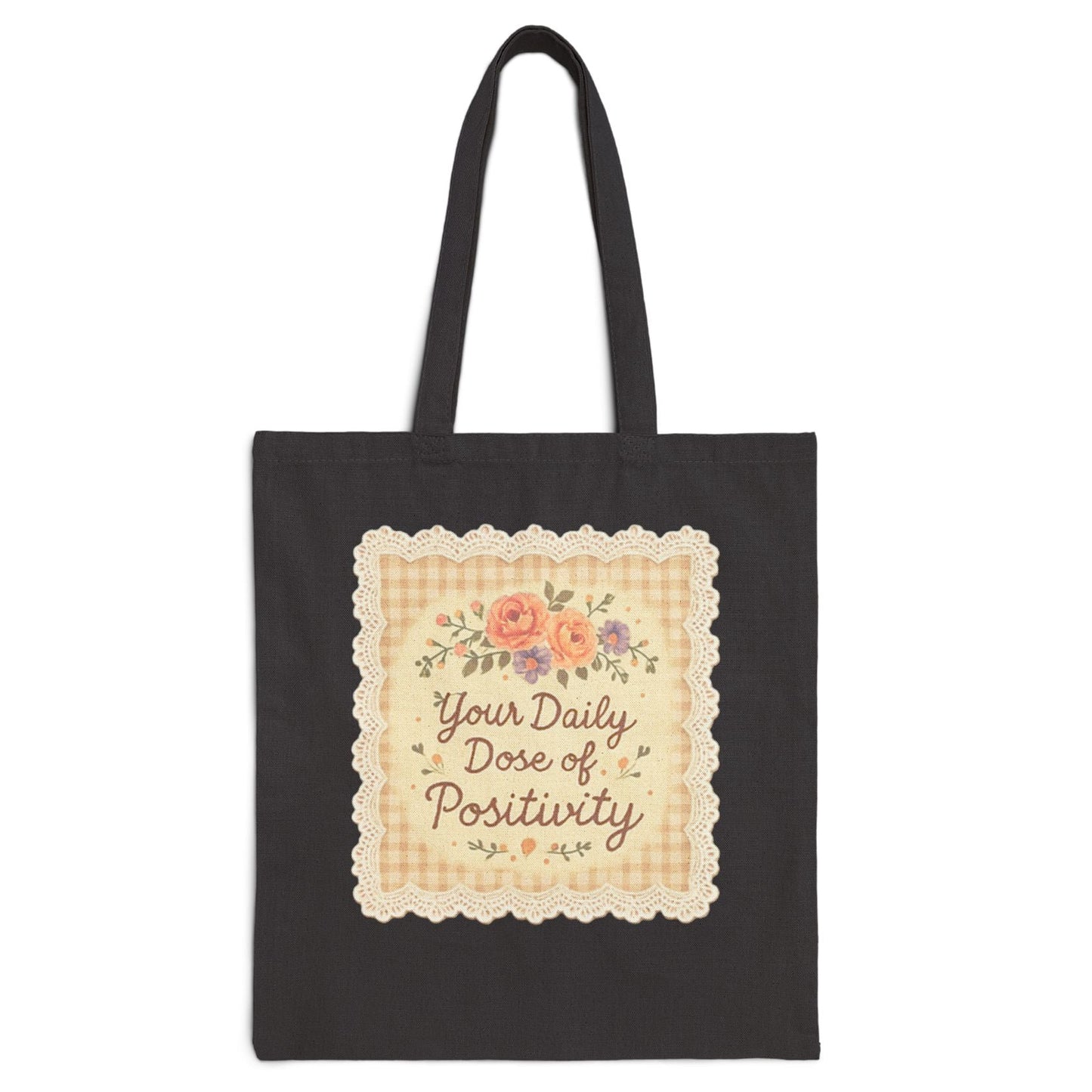 Black tote bag with decorative text and floral design on a white background