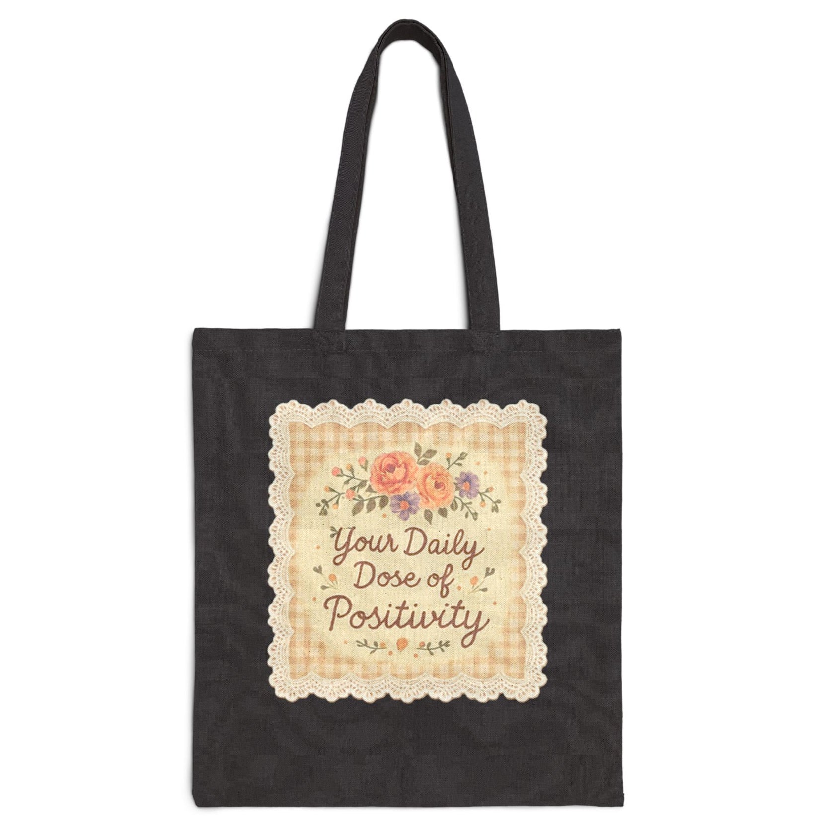 Black tote bag with decorative text and floral design on a white background