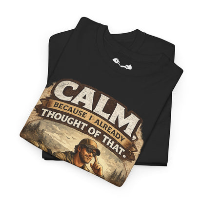 Folded black t-shirt with graphic design and text on a white background