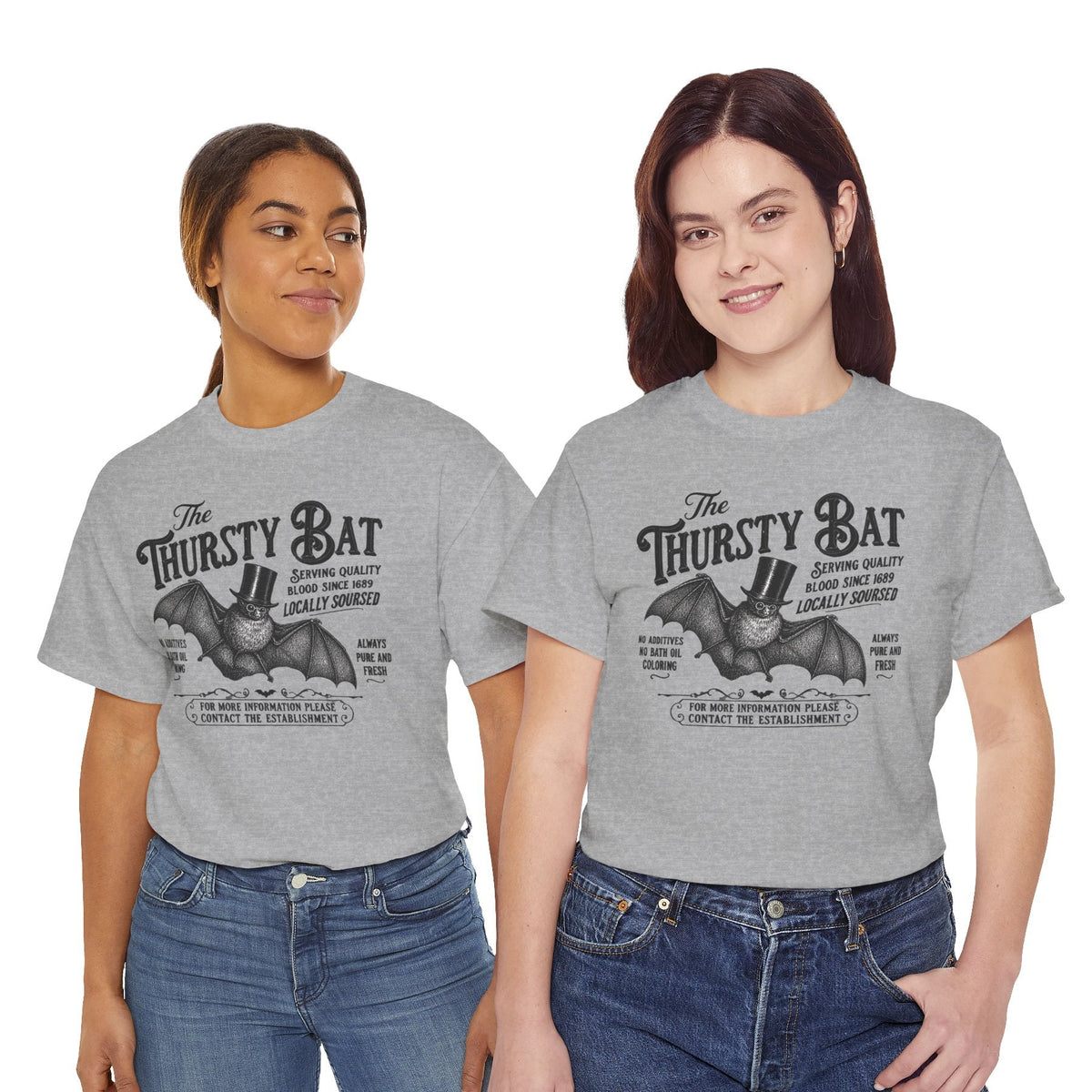 Two women wearing gray t-shirts with a nature graphic and text on a white background