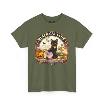 An olive green short-sleeve t-shirt with a detailed Halloween graphic on the front. The graphic features a black cat, a pumpkin, a potion bottle, a crystal ball, and a banner that reads 'BLACK CAT CLUB' and 'MAGIC * SPIRITS * FORTUNE'.