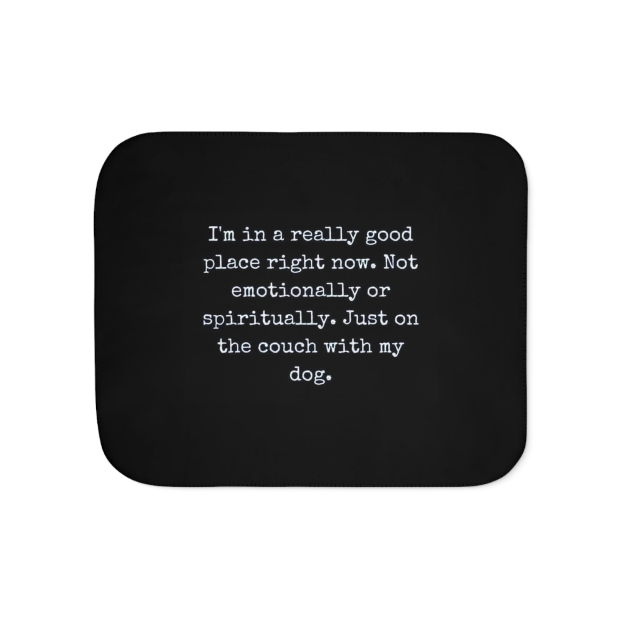 Black mouse pad with white text on a white background