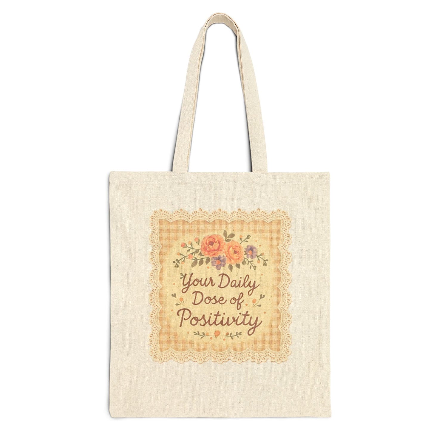 Tote bag with 'Your Daily Dose of Positivity' text and floral design on a white background