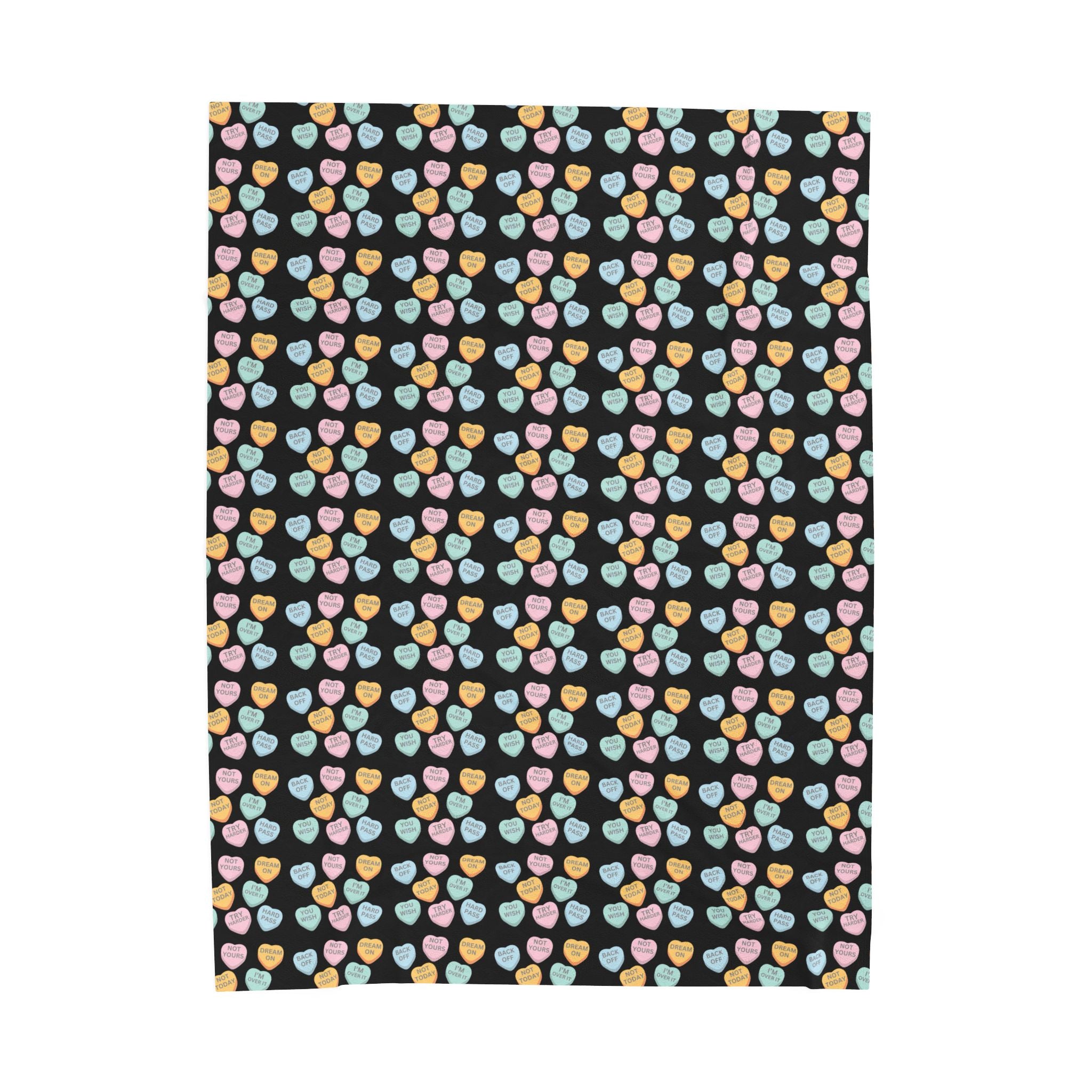 Patterned fabric with colorful hearts on a black background