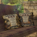 Decorative pillows with text on a wooden swing against a stone wall and forest background