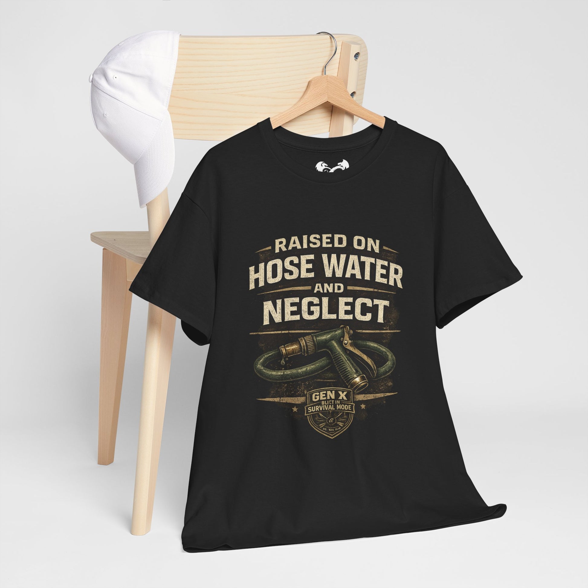 Black t-shirt with 'Play Renegade' text on a wooden chair against a white background