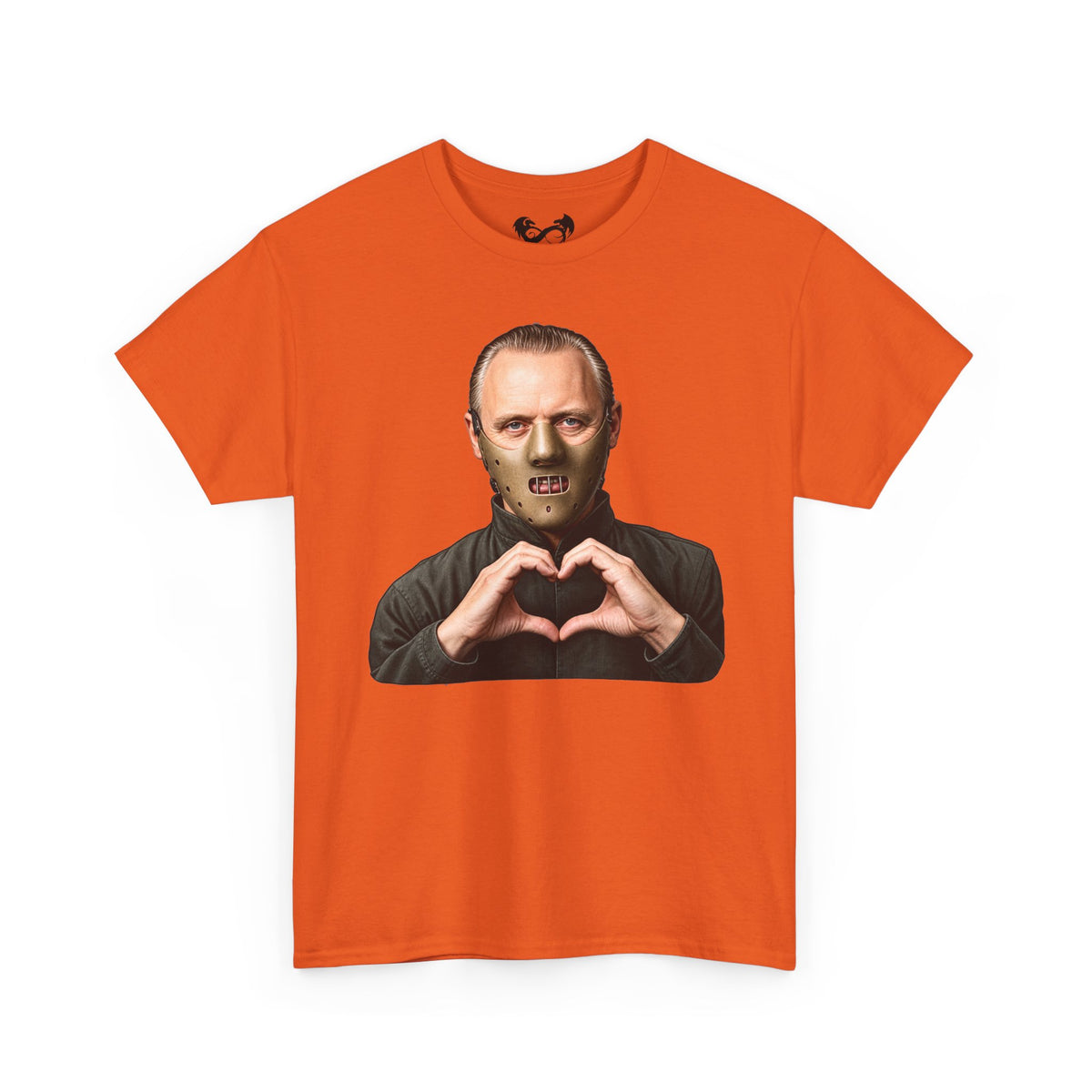 An orange short-sleeve crewneck t-shirt featuring a graphic print of a man in a black turtleneck making a heart shape with his hands, set against a plain white background.