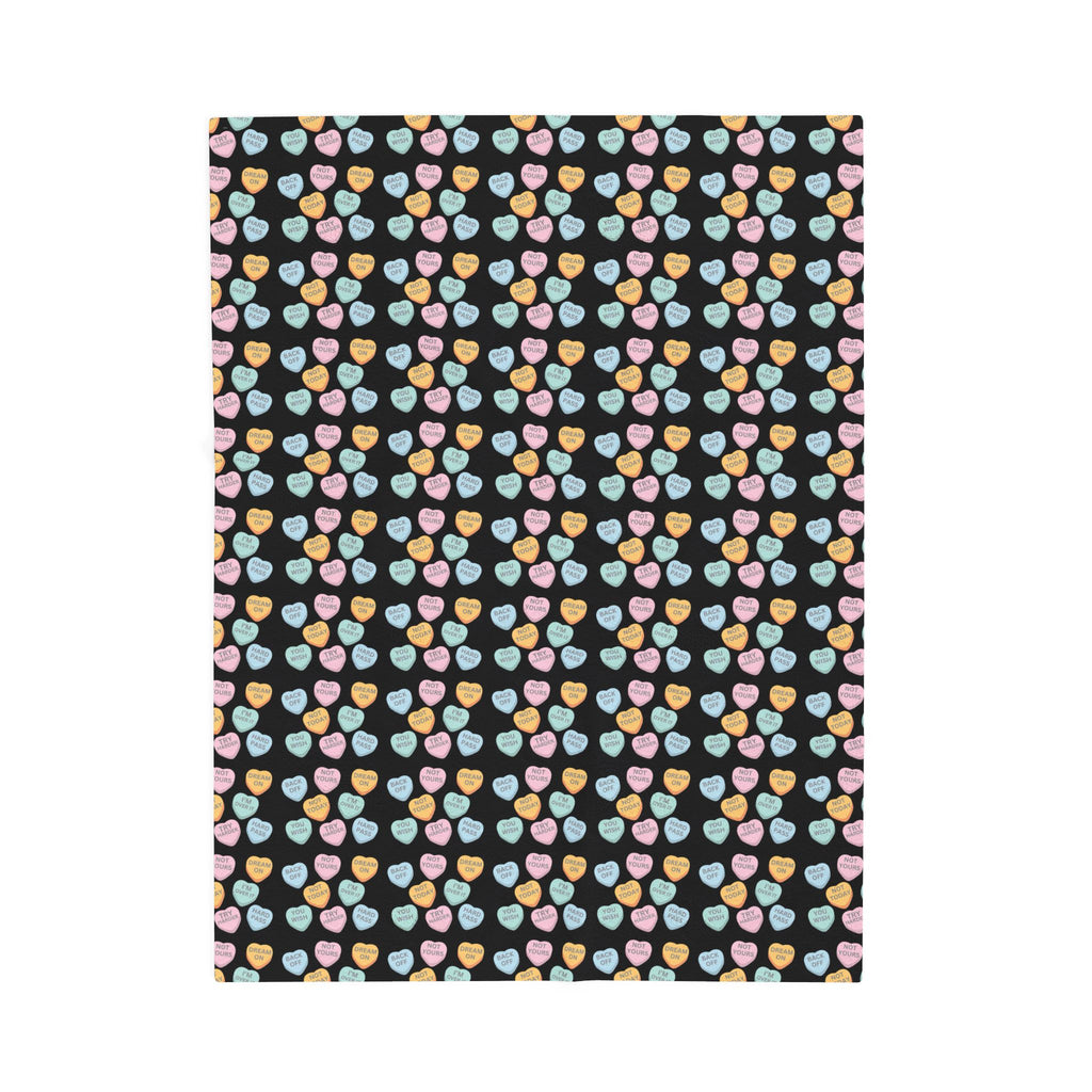Patterned fabric with colorful hearts on a black background