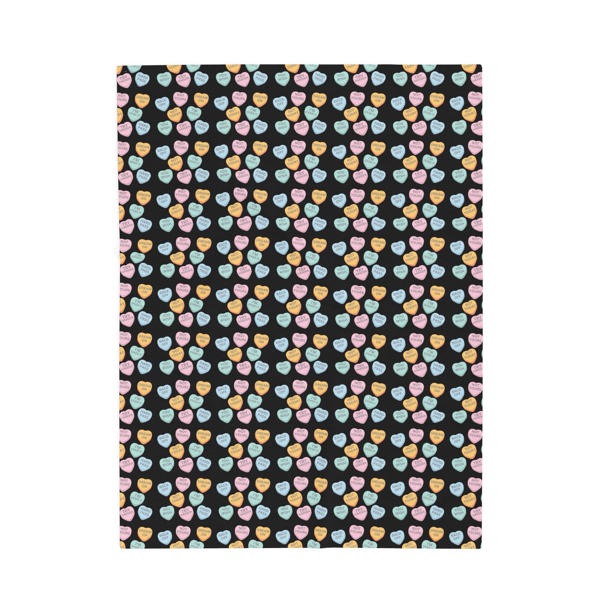 Patterned fabric with colorful hearts on a black background