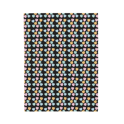 Patterned fabric with colorful hearts on a black background