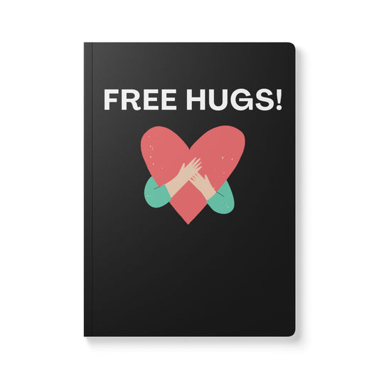 Black notebook with a red heart and hands design, and 'FREE HUGS!' text on a white background