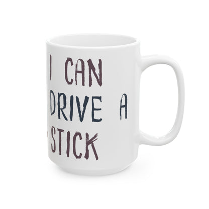 White mug with text 'I CAN DRIVE A STICK' on a white background
