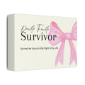 Box with pink bow and text 'Double Trouble Survivor' on a white background