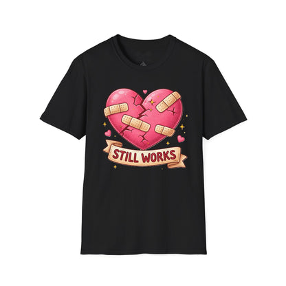 Black t-shirt with a heart graphic and 'Still Works' text on a white background