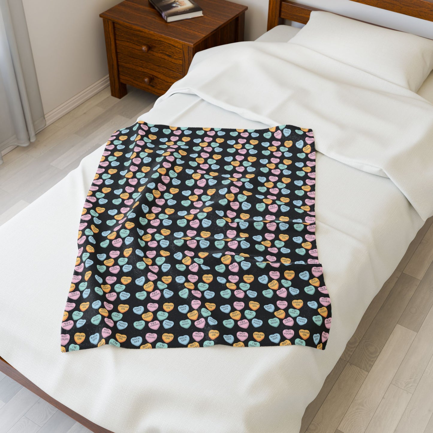 Colorful patterned blanket on a bed in a bedroom setting