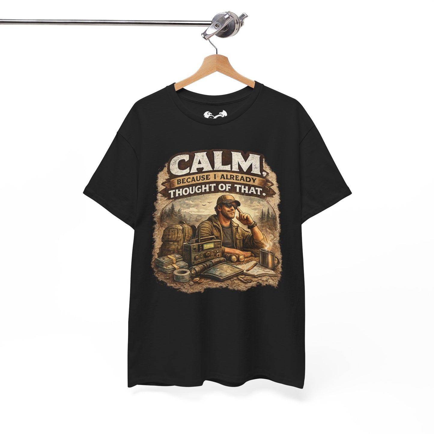 Black t-shirt with graphic design and text on a hanger against a white background