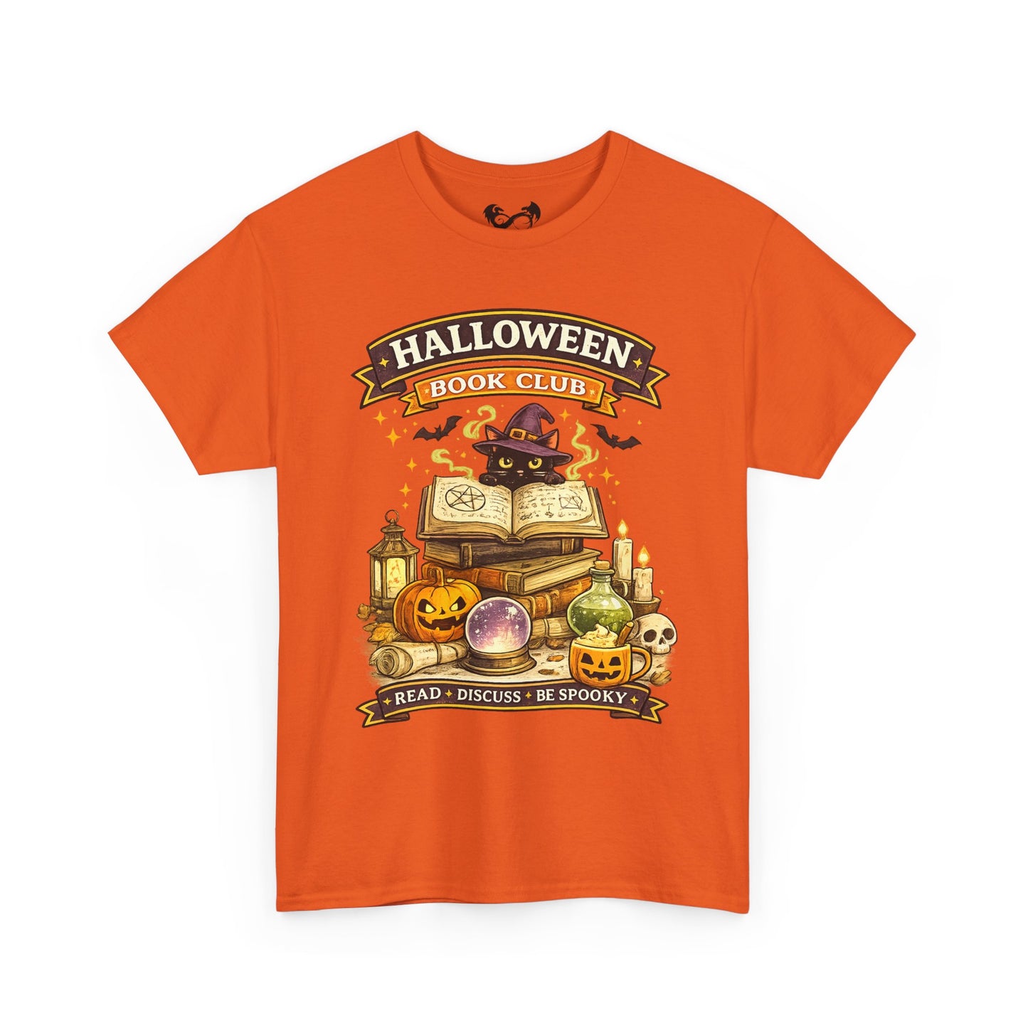 An orange short-sleeve crewneck t-shirt featuring a colorful graphic print on the front with the text 'HALLOWEEN BOOK CLUB' and a spooky illustration of books, pumpkins, a cauldron, and a cat in a witch hat.