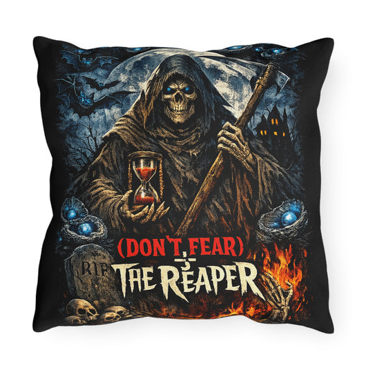 A square black throw pillow featuring a detailed graphic print of the Grim Reaper holding an hourglass and an axe, with the text '(DON'T FEAR) IS THE REAPER' and gothic scene elements including a moon, haunted house, skulls, and flames.