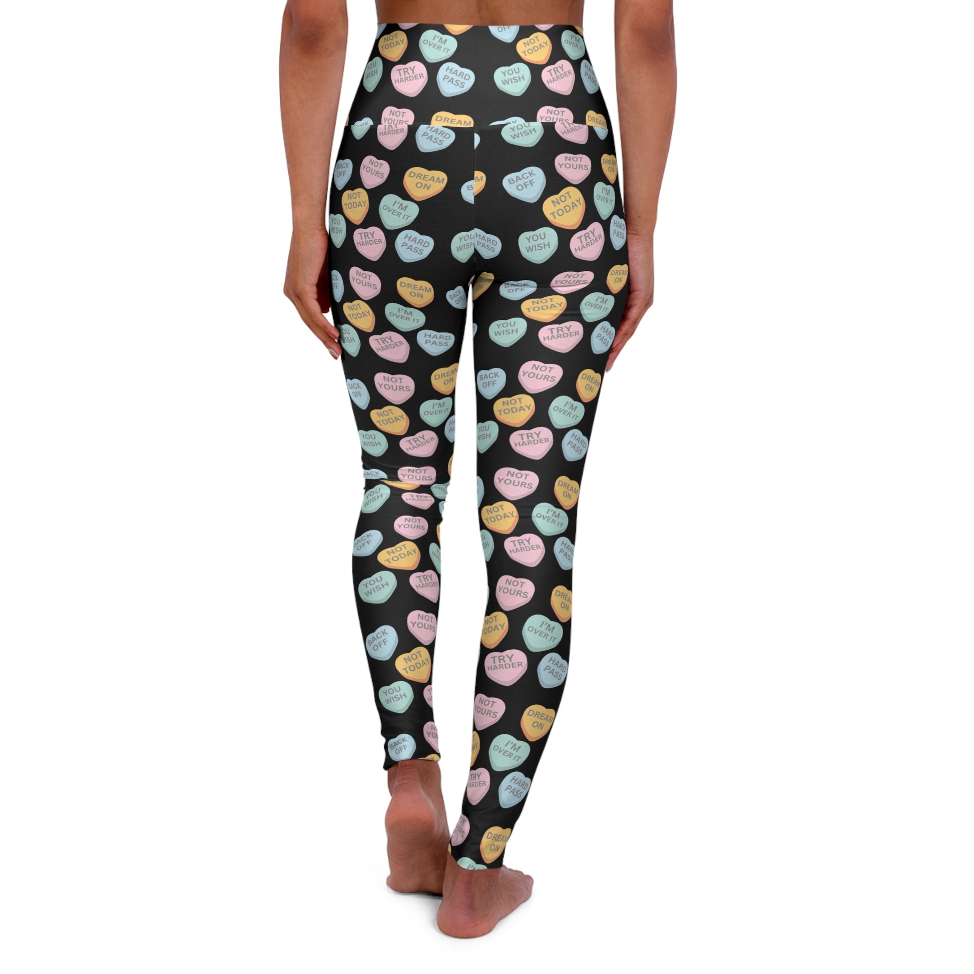 Leggings with colorful heart pattern on a black background
