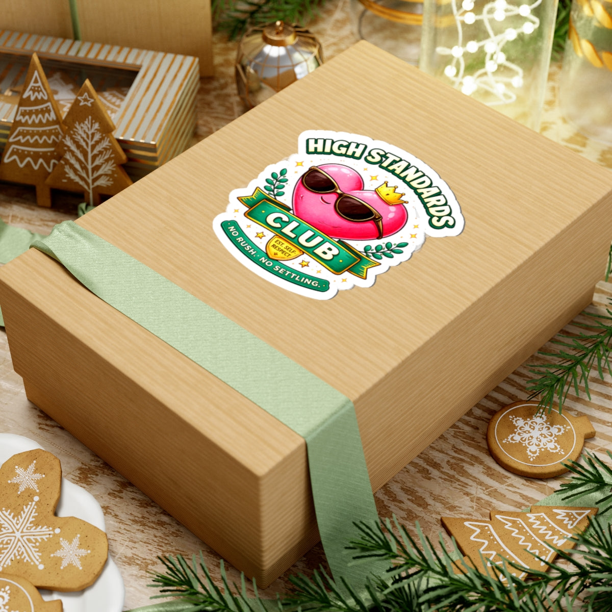 Wooden gift box with a 'High Standards Club' sticker on a festive background with cookies and decorations.