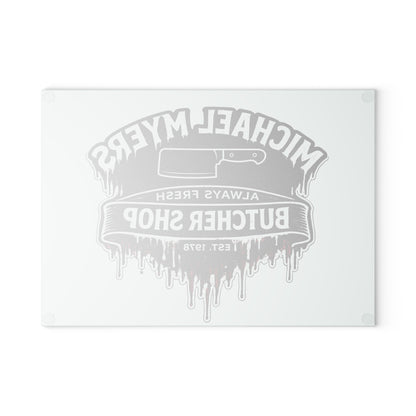 A rectangular white cutting board with rounded corners, featuring a gray dripping butcher shop graphic with a cleaver illustration and the text 'Michael Myers Butcher Shop' and 'Always Fresh'.