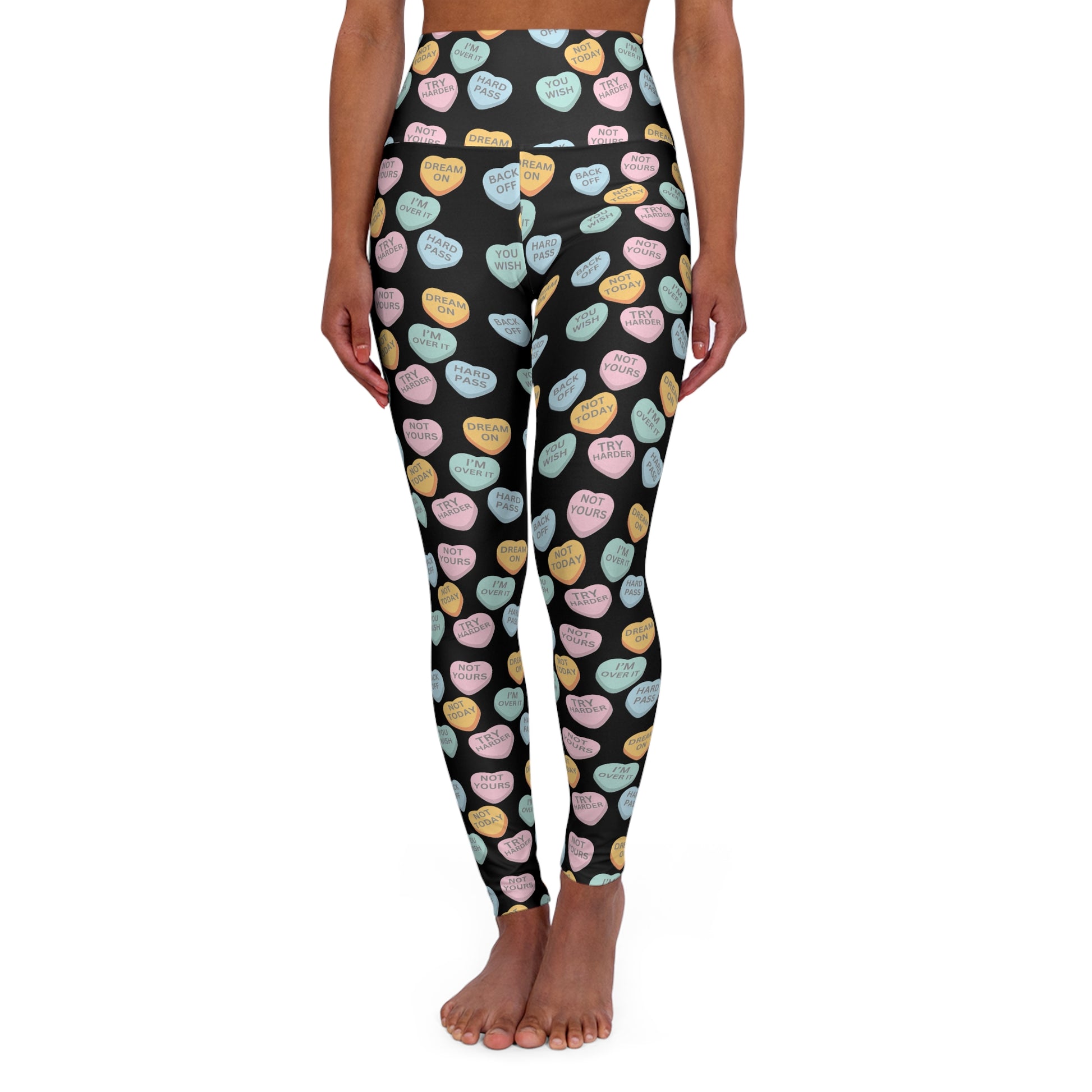 Leggings with colorful heart pattern on a black background