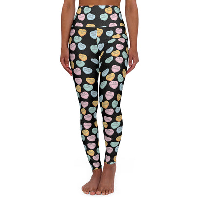 Leggings with colorful heart pattern on a black background