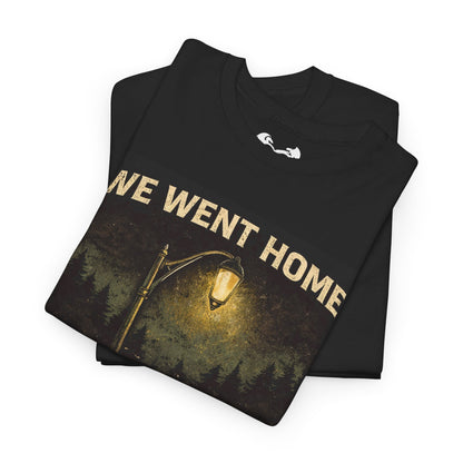 Folded black t-shirt with 'WE WENT HOME' text and graphic on a white background