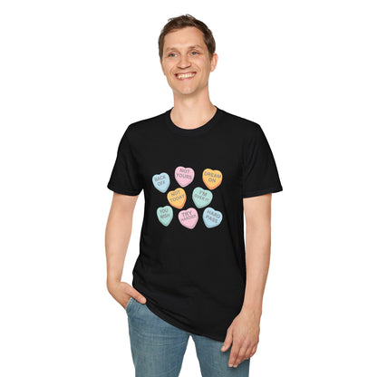 Person wearing a black t-shirt with colorful heart-shaped text design on a white background
